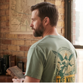 Faithful Citizens Apparel Co Men's T-shirt The king returns A flying Jesus illustration and green lettering Philippians 2:10-11 Bay