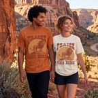 Faithful Citizens Apparel Co Men's T-shirt featuring a bold “Praise the King” lettering and a lion illustration Psalm 47:7 Yam/Ivory