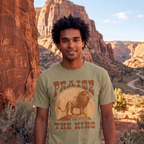 Faithful Citizens Apparel Co Men's T-shirt featuring a bold “Praise the King” lettering and a lion illustration Psalm 47:7 Khaki